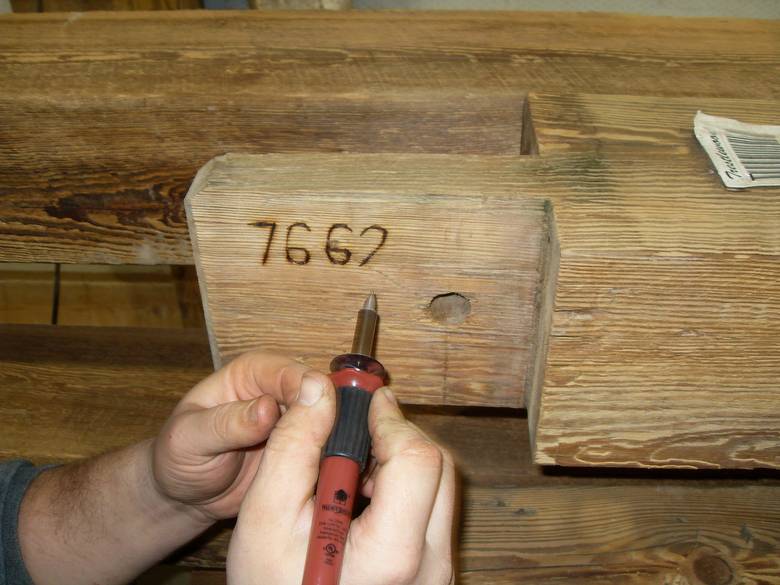 Camp Barn Restoration / Cannon Salvage workers cleaning, applying borate, and waxing the frame.